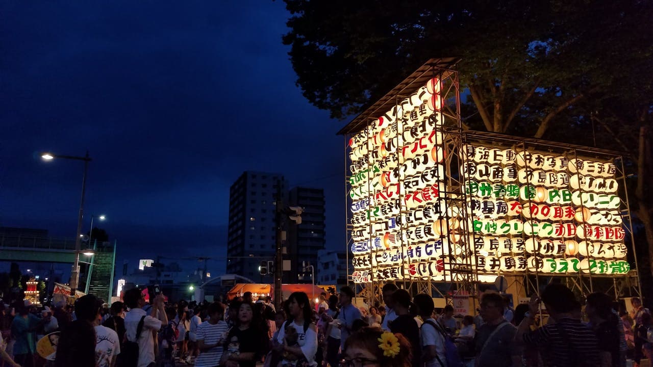 Lantern-lit festival float in a Japanese street